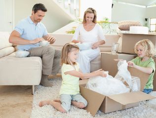 picture of family unpacking boxes