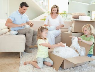 family unpacking their goods