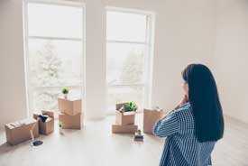 woman organizing boxes after a move